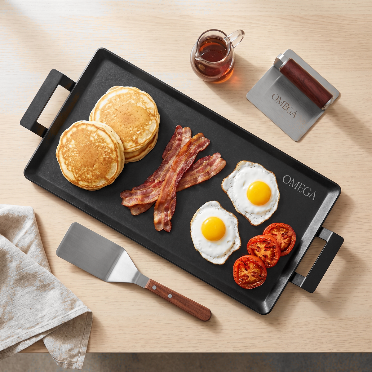 Pancakes, bacon and eggs on the OMEGA griddle, top view
