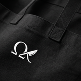 Close-up of the OMEGA logo and heavy-duty black canvas